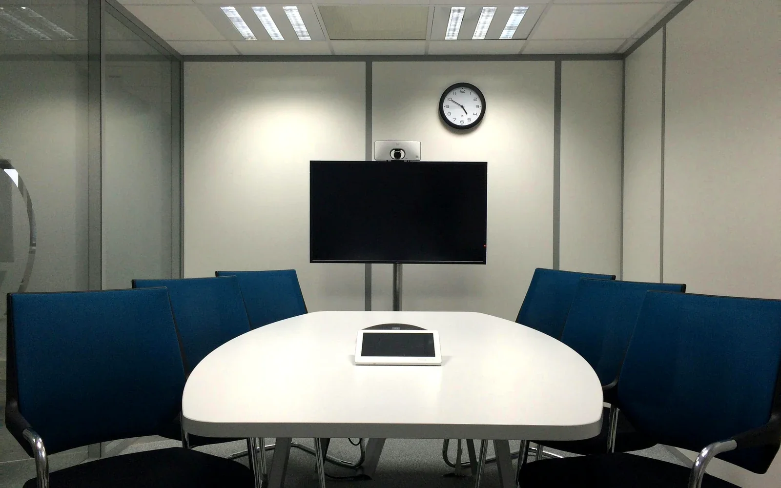 Neat meeting room AV setup with wall display