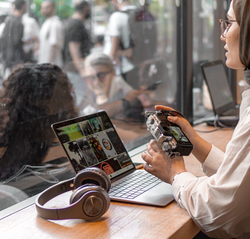 Woman Using a Laptop in a Restaurant